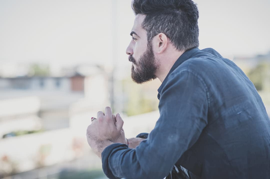 Man contemplating and overlooking a landscape