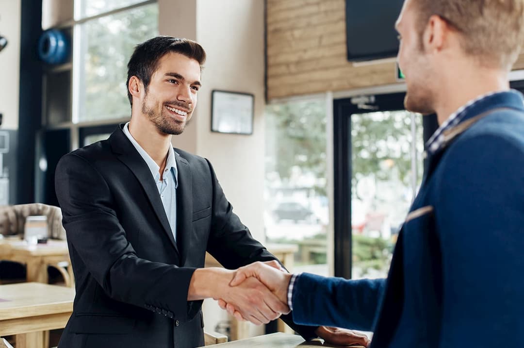 Two men meeting, shaking hands